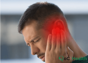 man suffering with tinnitus pain